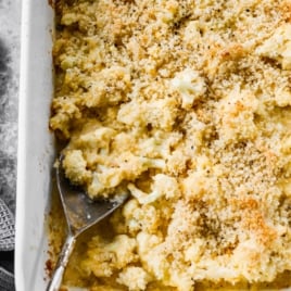 a pan of cheesy cauliflower "mac" and cheese