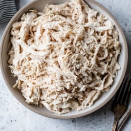 overhead view of shredded chicken breast in bowl