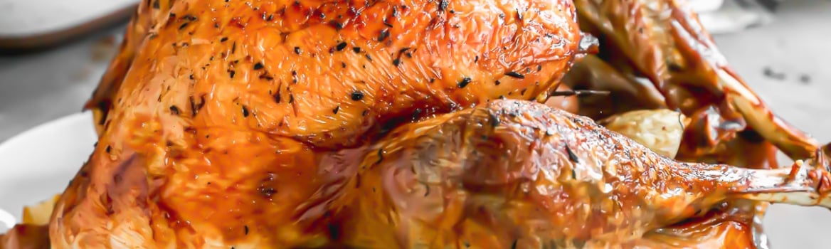 juicy roasted thanksgiving turkey on a platter for thanksgiving