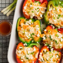 Easy buffalo chicken stuffed peppers in a baking dish