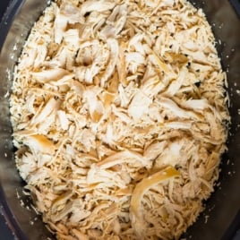 shredded crockpot chicken in a slow cooker