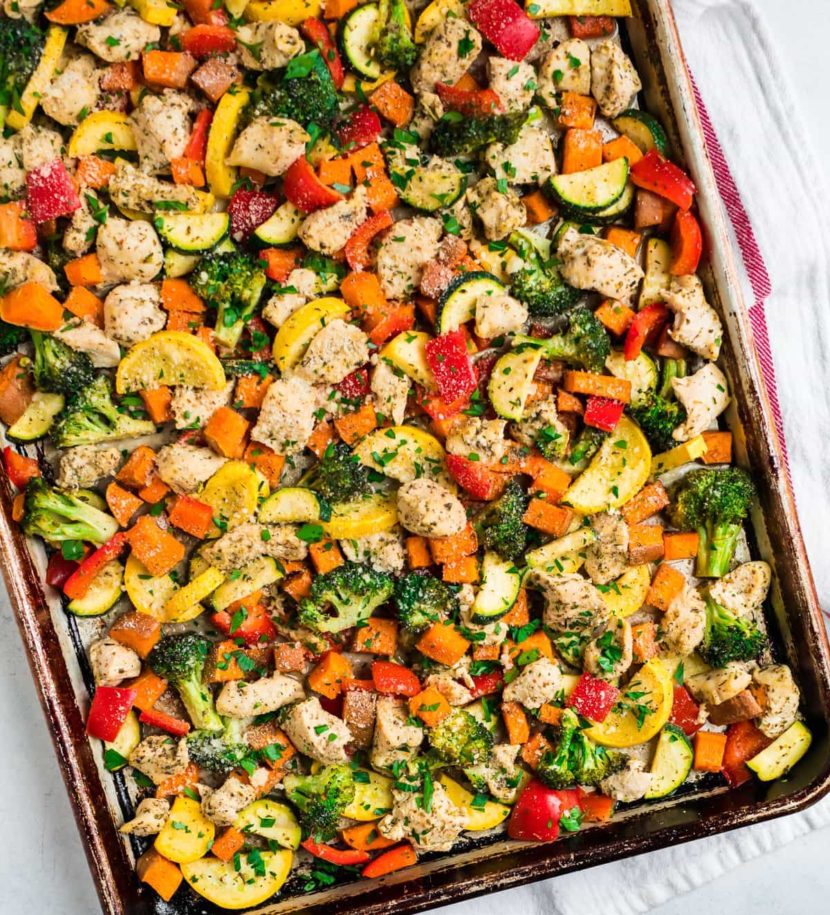 A sheet pan dinner with chicken and vegetables