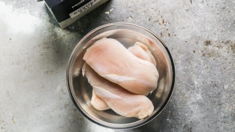 Raw meat in a bowl of salted water