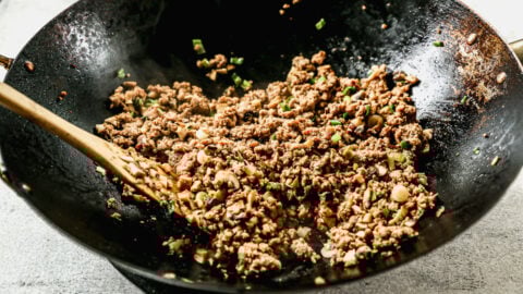 a wok of an asian-spiced filling of ground trukey and vegetables to make easy egg roll in a bowl