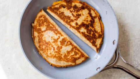 chicken quesadillas being cooked in a skillet