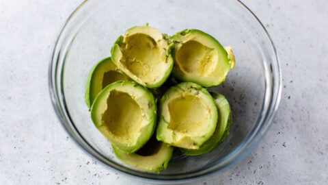 Halved avocados in a bowl
