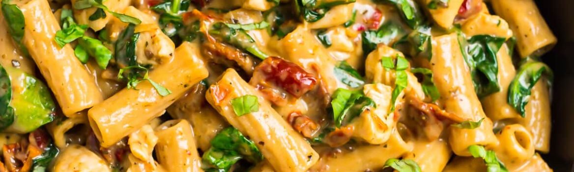 Mac and cheese with chicken breast in a skillet